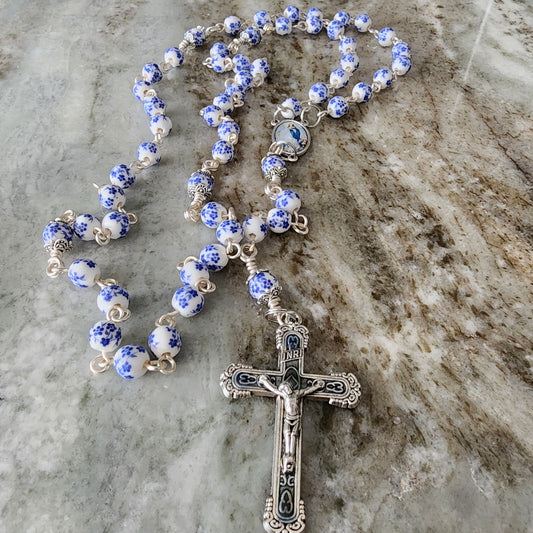 Rosary with Blue Flowers on White Porcelain and Assumption of Mary Center and Crucifix