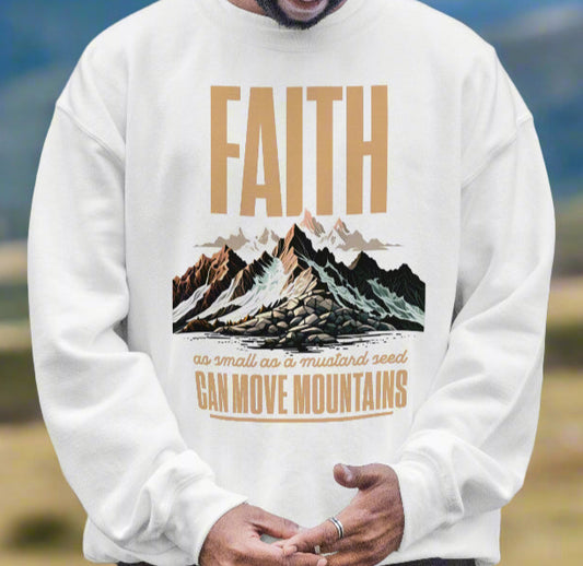 A white sweatshirt with the words Faith as small as a mustard seed can move mountains. It has a mountain range on it